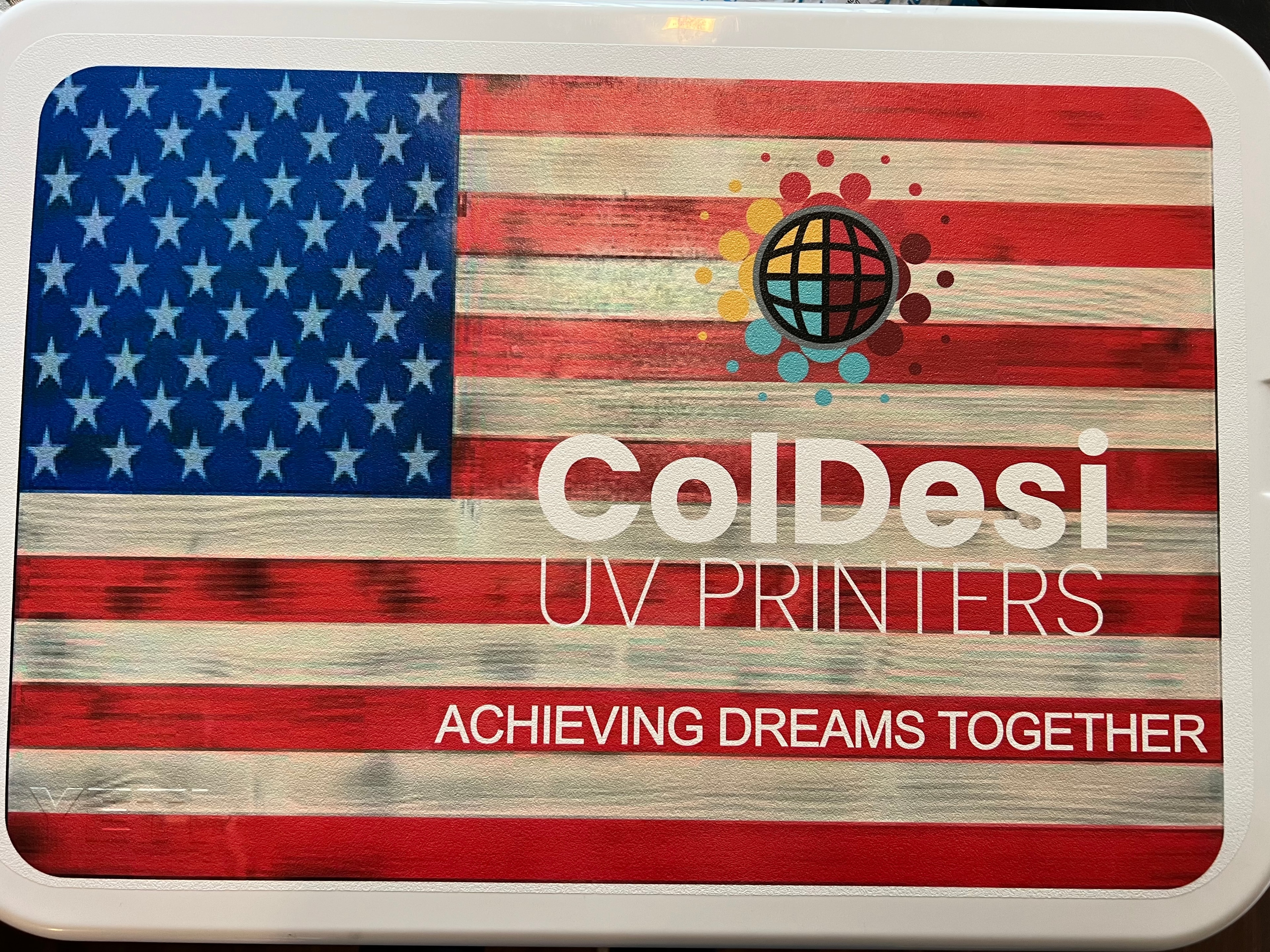 Full-bleed UV digital print on a YETI cooler lid with American flag design and ColDesi branding